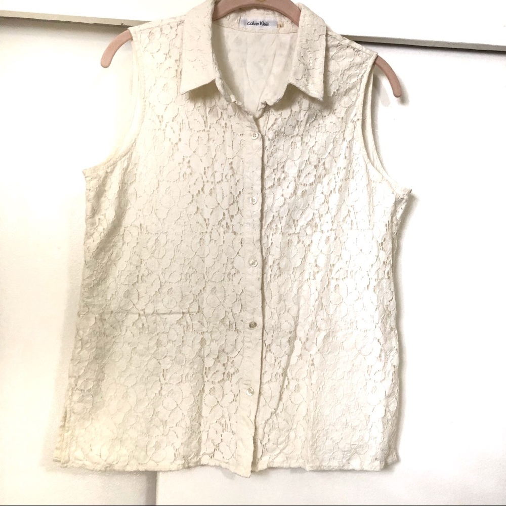 Calvin Klein: short sleeve lace top. Button up